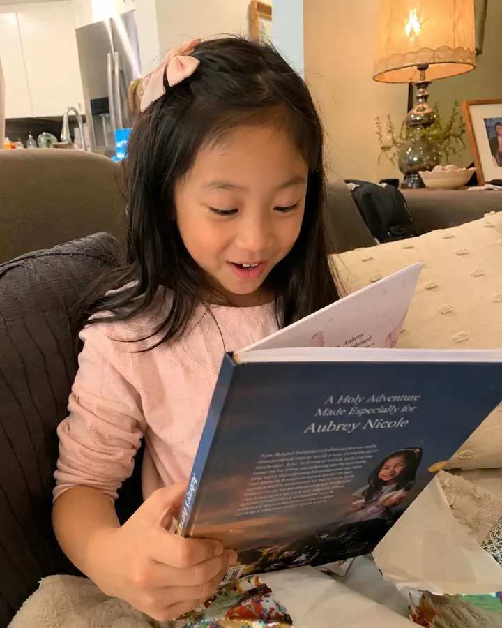 Aubrey reading her personalized story